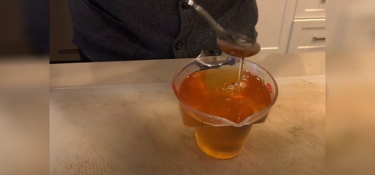 agave syrup on a measuring cup