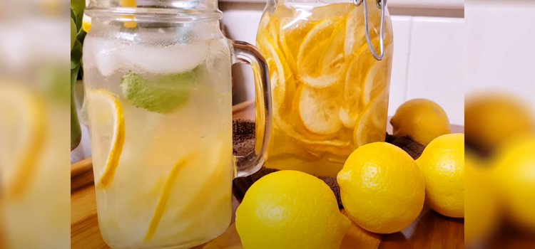 glass of lemonade juice and lemon fruit on a table